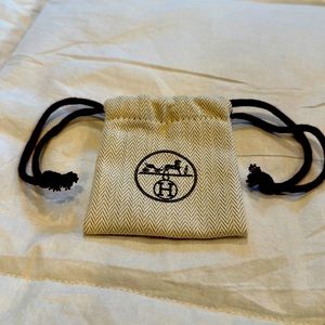 Hermes small cloth drawstring bag. Classic chevron pattern.